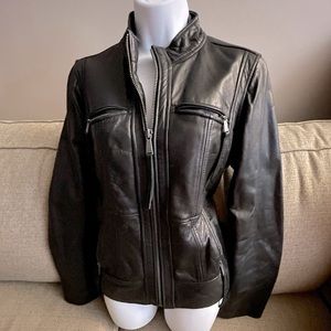 Michael Kors brown butter leather jacket; zippered closure for front/pockets.
